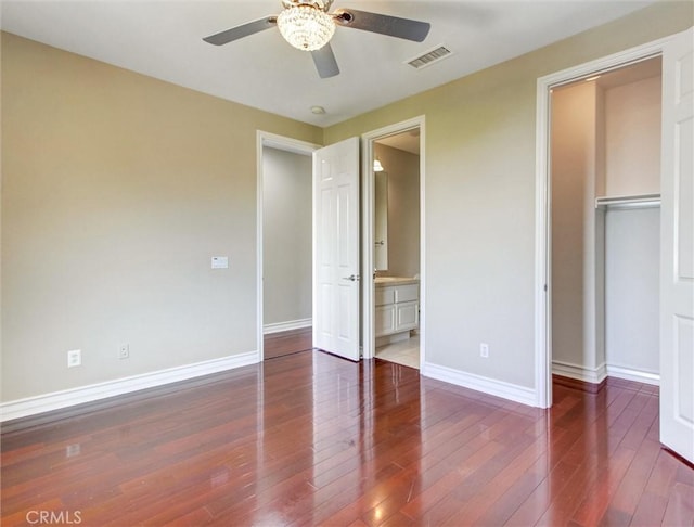2237 Sageleaf Cir, Corona, CA 92882 - unfurnished bedroom featuring baseboards, hardwood / wood-style flooring, a closet, ceiling fan, and ensuite bathroom