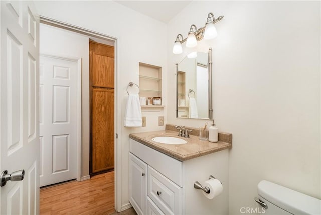 5631 Lake Park Way Unit 2, La Mesa, CA 91942 - half bath featuring vanity, toilet, and wood finished floors