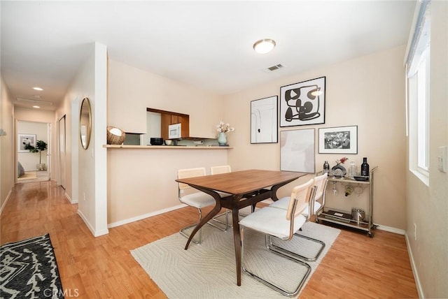5631 Lake Park Way Unit 2, La Mesa, CA 91942 - dining space with light wood-type flooring and baseboards