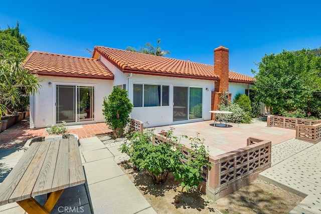 1702 Lark Tree Way, Hacienda Heights, CA 91745 - rear view of property featuring a tiled roof, a patio area, and stucco siding