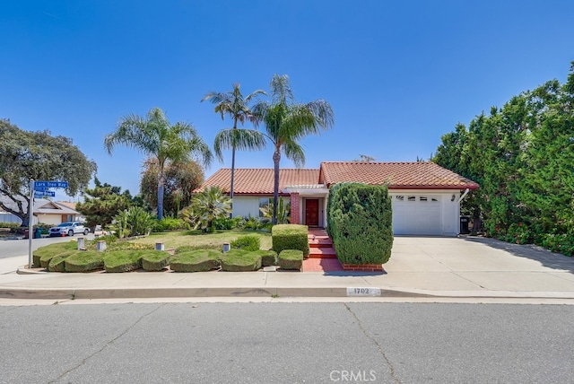 1702 Lark Tree Way, Hacienda Heights, CA 91745 - view of front of property featuring a tile roof, driveway, a garage, and stucco siding