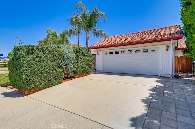 1702 Lark Tree Way, Hacienda Heights, CA 91745 - view of front of house featuring a tiled roof, a garage, and driveway