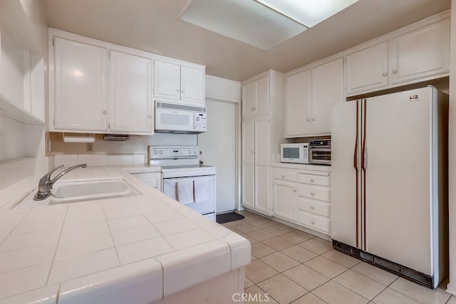 1702 Lark Tree Way, Hacienda Heights, CA 91745 - kitchen with white appliances, a sink, tile countertops, white cabinets, and light tile patterned floors