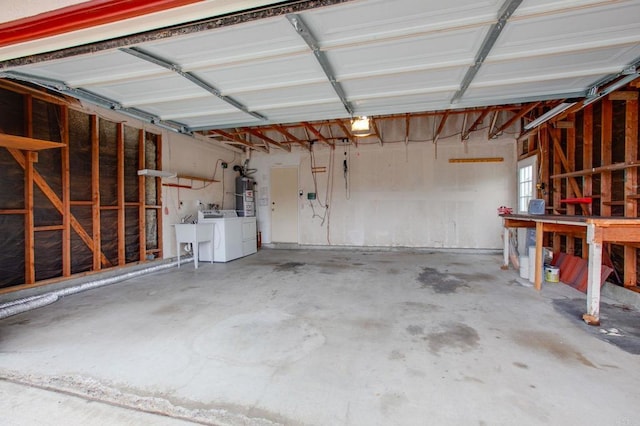 9336 Nalini Ct, Santee, CA 92071 - garage featuring secured water heater and separate washer and dryer