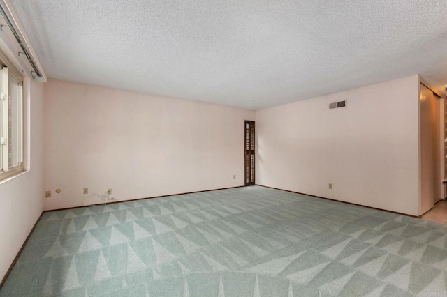 9336 Nalini Ct, Santee, CA 92071 - unfurnished room featuring light carpet and a textured ceiling