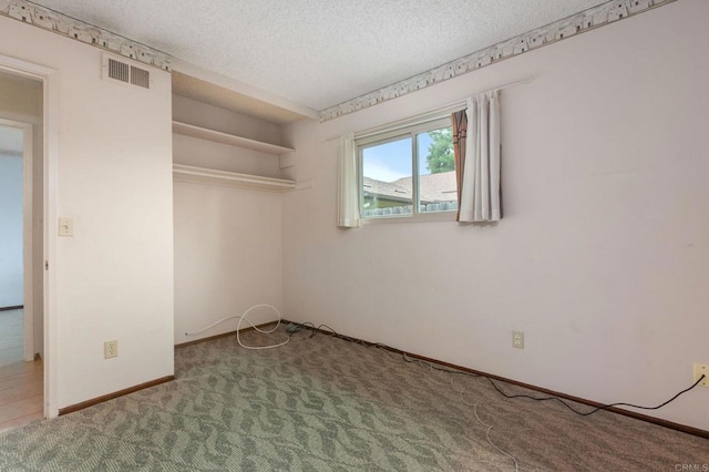 9336 Nalini Ct, Santee, CA 92071 - unfurnished bedroom featuring a textured ceiling, carpet floors, and a closet