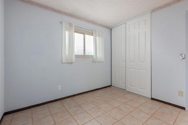 9336 Nalini Ct, Santee, CA 92071 - unfurnished bedroom with a textured ceiling and a closet