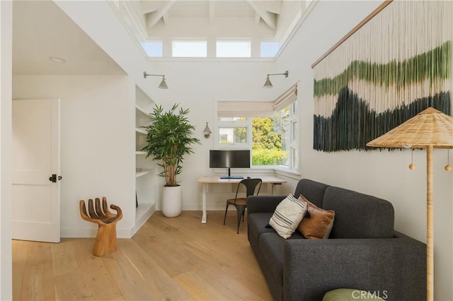 2104 Flournoy Rd, Manhattan Beach, CA 90266 - living area with wood finished floors, beamed ceiling, and baseboards