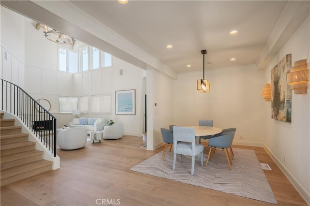 2104 Flournoy Rd, Manhattan Beach, CA 90266 - dining space with wood finished floors, stairs, baseboards, recessed lighting, and a chandelier