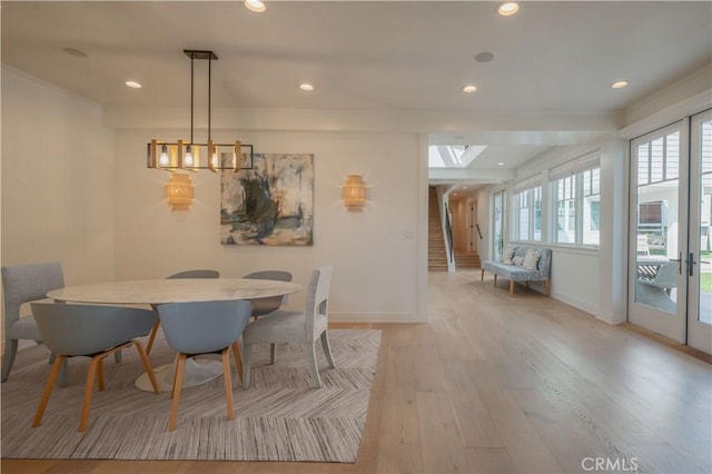 2104 Flournoy Rd, Manhattan Beach, CA 90266 - dining space with baseboards, wood finished floors, recessed lighting, and a skylight