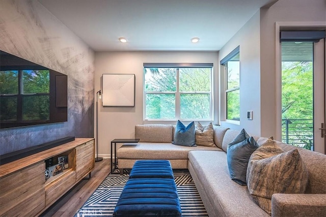 9630 Nova Pl, Rancho Cucamonga, CA 91730 - living area with healthy amount of natural light, wood finished floors, baseboards, and recessed lighting