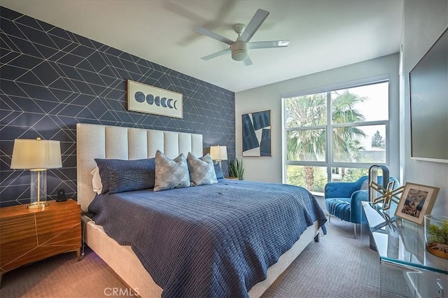 9630 Nova Pl, Rancho Cucamonga, CA 91730 - bedroom with carpet floors, an accent wall, and a ceiling fan