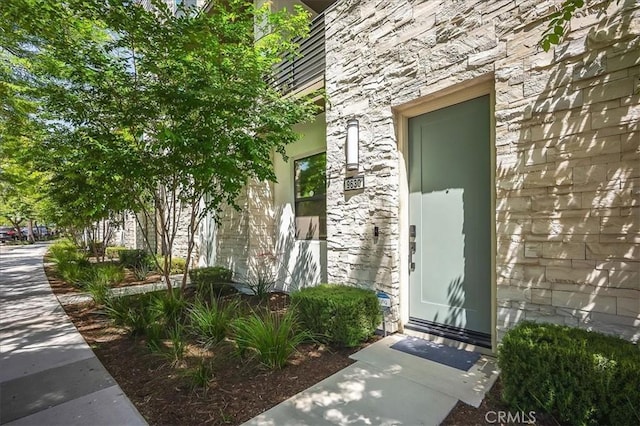 9630 Nova Pl, Rancho Cucamonga, CA 91730 - doorway to property featuring stone siding