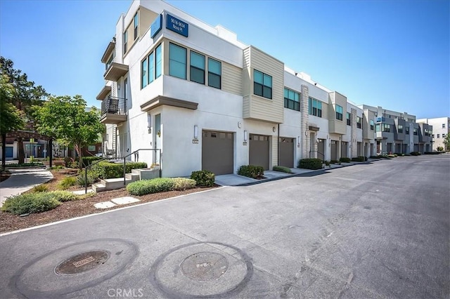 9630 Nova Pl, Rancho Cucamonga, CA 91730 - view of property featuring a residential view and an attached garage