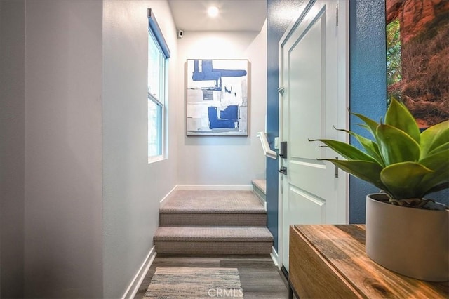 9630 Nova Pl, Rancho Cucamonga, CA 91730 - entryway with plenty of natural light, baseboards, stairway, a textured wall, and wood finished floors