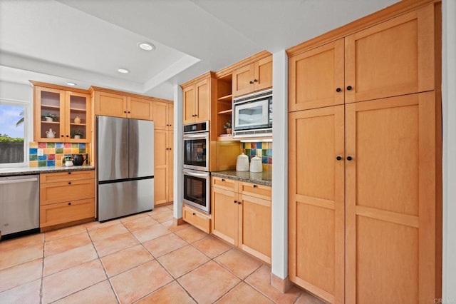1033 Via Mil Cumbres, Solana Beach, CA 92075 - kitchen with stainless steel appliances, recessed lighting, tasteful backsplash, open shelves, and glass insert cabinets