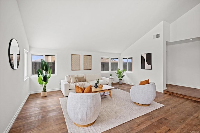 1033 Via Mil Cumbres, Solana Beach, CA 92075 - living area with high vaulted ceiling, healthy amount of natural light, wood finished floors, and baseboards