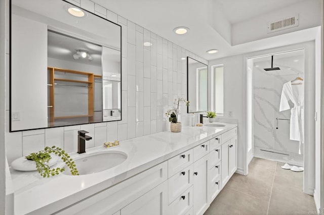 1033 Via Mil Cumbres, Solana Beach, CA 92075 - bathroom featuring double vanity, a marble finish shower, recessed lighting, and tile patterned floors