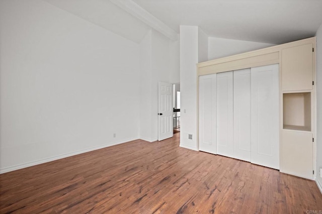 1033 Via Mil Cumbres, Solana Beach, CA 92075 - unfurnished bedroom with vaulted ceiling, wood finished floors, baseboards, and a closet