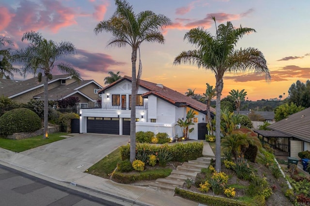 1033 Via Mil Cumbres, Solana Beach, CA 92075 - view of front facade featuring a garage, concrete driveway, and stairs