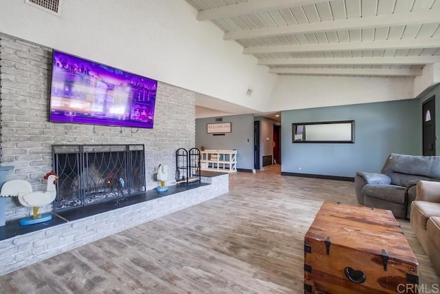 826 Terra Ln, El Cajon, CA 92019 - living area featuring wood finished floors, baseboards, a brick fireplace, wooden ceiling with exposed beams, and high vaulted ceiling
