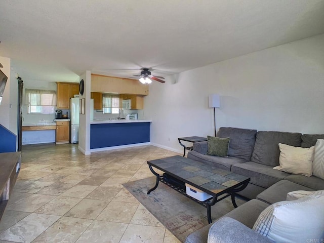1466 15th St, Imperial Beach, CA 91932 - living area featuring a ceiling fan and baseboards
