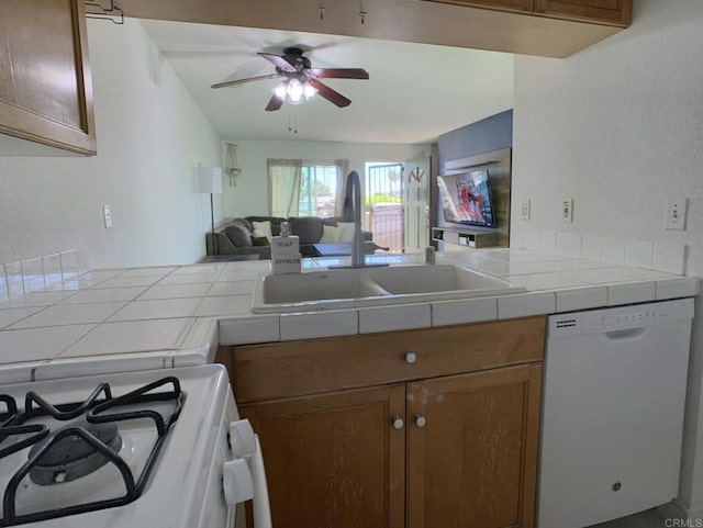 1466 15th St, Imperial Beach, CA 91932 - kitchen with white appliances, a sink, tile counters, a ceiling fan, and brown cabinetry