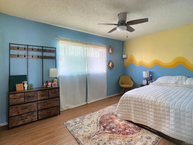 1466 15th St, Imperial Beach, CA 91932 - bedroom featuring wood finished floors, a textured ceiling, and ceiling fan