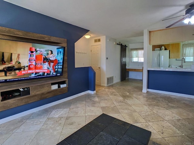 1466 15th St, Imperial Beach, CA 91932 - home theater room featuring a barn door, ceiling fan, baseboards, and a sink