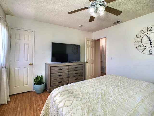 1466 15th St, Imperial Beach, CA 91932 - bedroom with wood finished floors, a textured ceiling, and ceiling fan