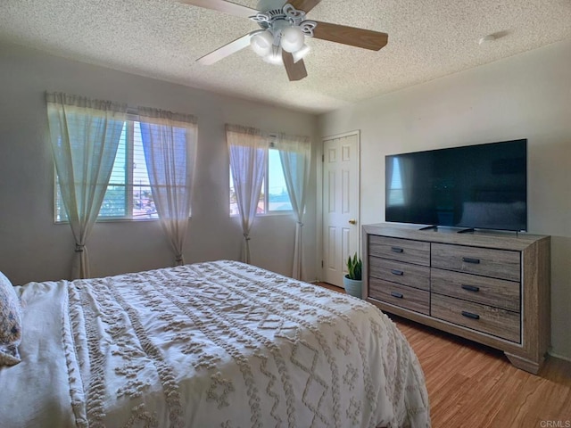 1466 15th St, Imperial Beach, CA 91932 - bedroom with a textured ceiling, light wood finished floors, a ceiling fan, and a closet