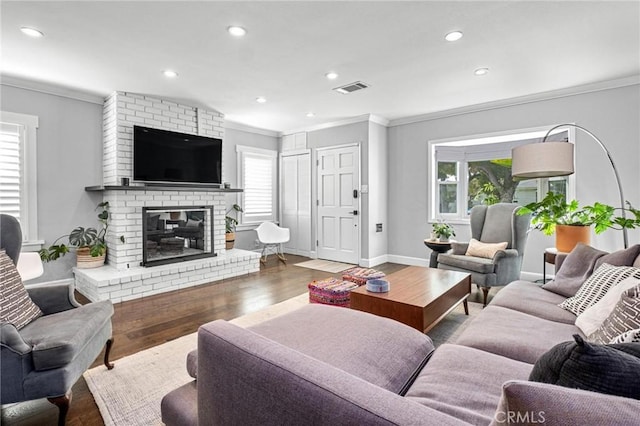 3440 Lemon Ave, Long Beach, CA 90807 - living area featuring ornamental molding, a brick fireplace, wood finished floors, recessed lighting, and baseboards