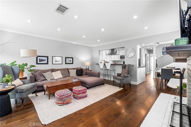 3440 Lemon Ave, Long Beach, CA 90807 - living area with dark wood-type flooring, recessed lighting, ornamental molding, and baseboards