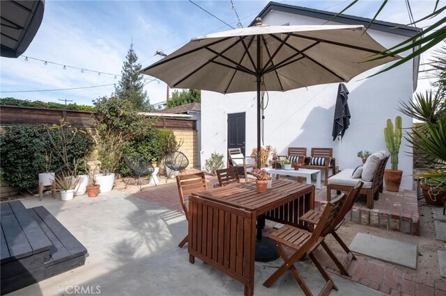 3440 Lemon Ave, Long Beach, CA 90807 - fenced backyard with a patio and outdoor lounge area