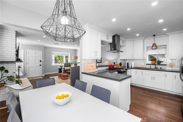 3440 Lemon Ave, Long Beach, CA 90807 - kitchen with a sink, wall chimney exhaust hood, recessed lighting, dark countertops, and tasteful backsplash