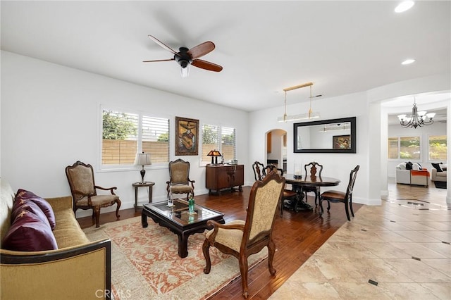 44774 Pride Mountain St, Temecula, CA 92592 - living area with arched walkways, recessed lighting, a ceiling fan, a chandelier, and baseboards