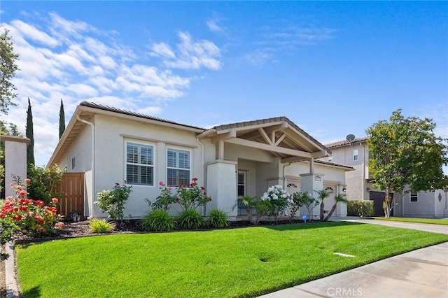 44774 Pride Mountain St, Temecula, CA 92592 - view of front of home with driveway, an attached garage, a front yard, and stucco siding