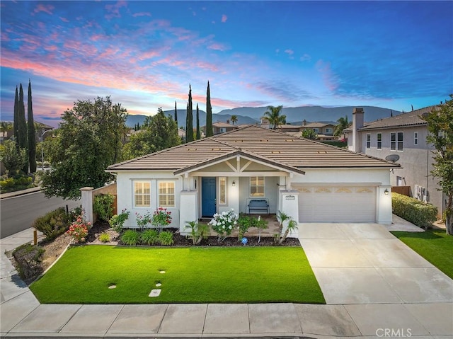44774 Pride Mountain St, Temecula, CA 92592 - ranch-style home featuring concrete driveway, an attached garage, stucco siding, a tiled roof, and covered porch
