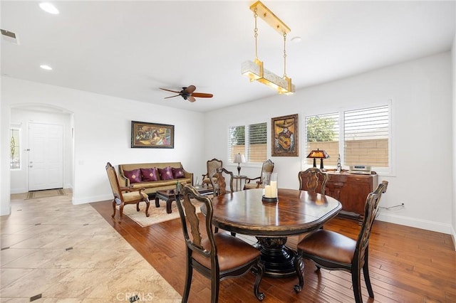 44774 Pride Mountain St, Temecula, CA 92592 - dining room with a ceiling fan, arched walkways, baseboards, recessed lighting, and wood-type flooring