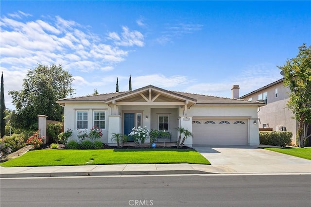 44774 Pride Mountain St, Temecula, CA 92592 - view of front of property featuring an attached garage, concrete driveway, a front yard, stucco siding, and a chimney
