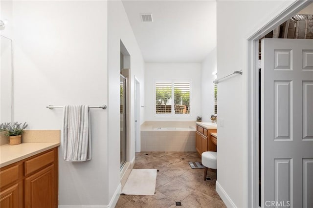 44774 Pride Mountain St, Temecula, CA 92592 - full bathroom featuring vanity, a garden tub, a stall shower, and baseboards