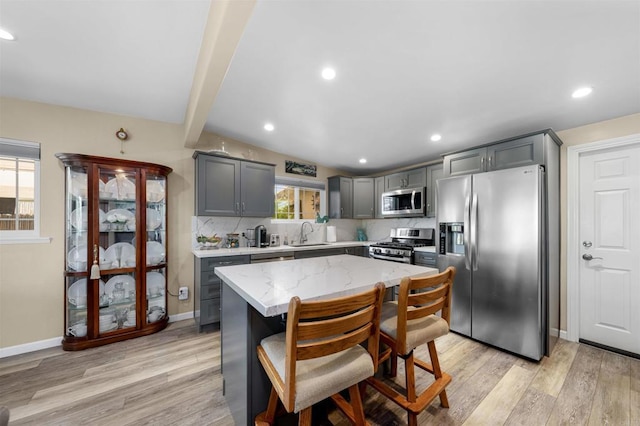 5680 Wendi St, La Mesa, CA 91942 - kitchen with appliances with stainless steel finishes, gray cabinets, a sink, light wood finished floors, and recessed lighting