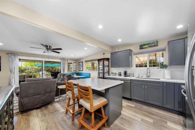 5680 Wendi St, La Mesa, CA 91942 - kitchen featuring a sink, appliances with stainless steel finishes, open floor plan, gray cabinetry, and light countertops