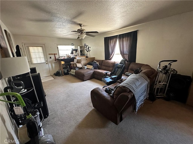 828 W 23rd St, Merced, CA 95340 - living room featuring carpet floors, ceiling fan, and a textured ceiling