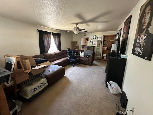 828 W 23rd St, Merced, CA 95340 - carpeted living room with ceiling fan and a textured ceiling