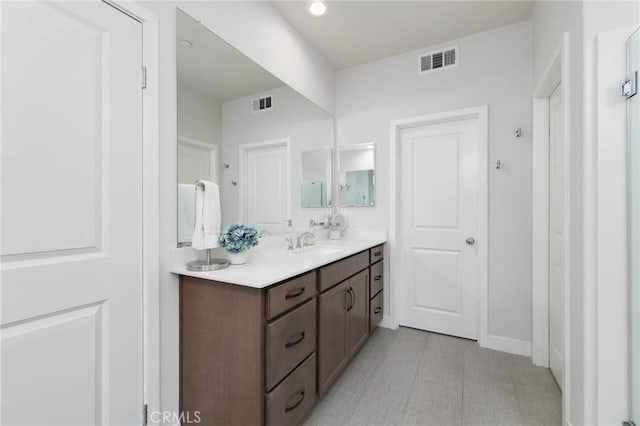 656 Daniel Freeman Cir, Inglewood, CA 90301 - bathroom with vanity, baseboards, and recessed lighting