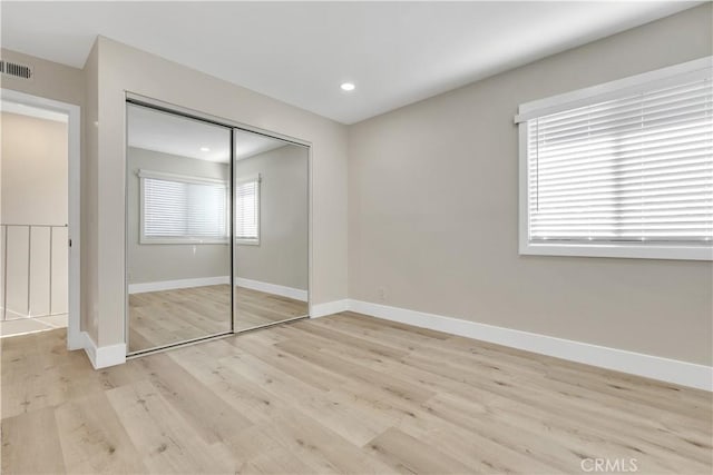 1425 Forest Glen Dr Unit 159, Hacienda Heights, CA 91745 - unfurnished bedroom with a closet, baseboards, light wood-style flooring, and recessed lighting