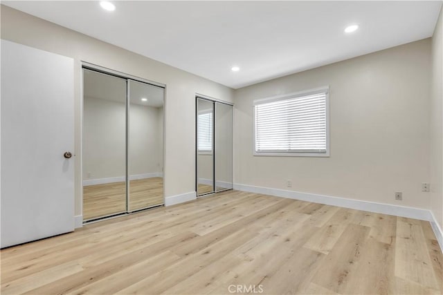 1425 Forest Glen Dr Unit 159, Hacienda Heights, CA 91745 - unfurnished bedroom featuring two closets, light wood-style floors, recessed lighting, and baseboards