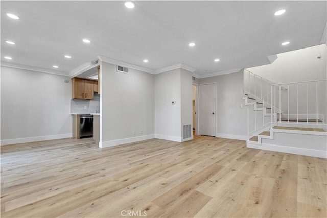 1425 Forest Glen Dr Unit 159, Hacienda Heights, CA 91745 - unfurnished living room with ornamental molding, recessed lighting, baseboards, stairs, and light wood-style flooring