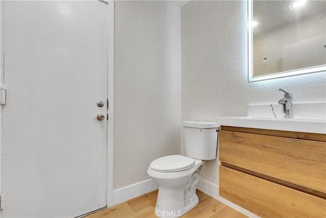 1425 Forest Glen Dr Unit 159, Hacienda Heights, CA 91745 - bathroom with toilet, wood finished floors, vanity, and baseboards